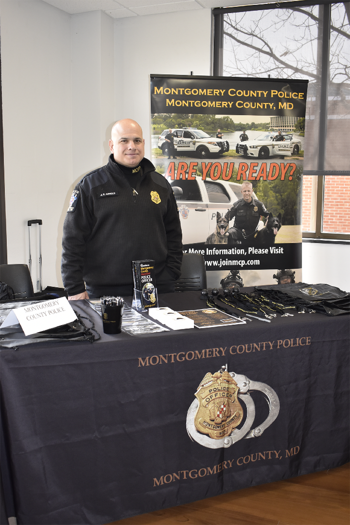 Officer represents an employer at career event