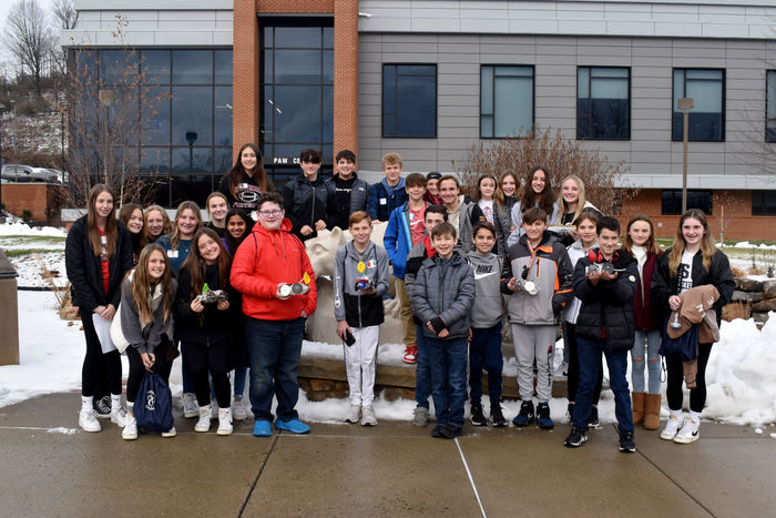 Students gather around the Nittany Lion shire prior to racing their vehicles in the PAW Center