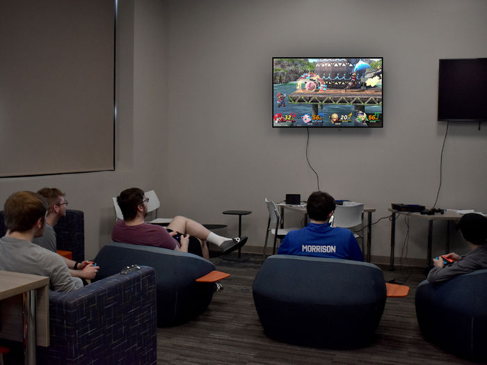 Students and members of the esports club at Penn State DuBois playing Super Smash Bros. during the inaugural game night in the gaming lounge at the PAW Center