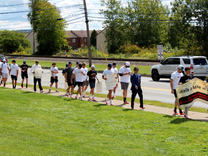Participants from Penn State DuBois being their mile journey to “Walk a Mile in Her Shoes” to raise awareness of rape, sexual assault and gender violence.