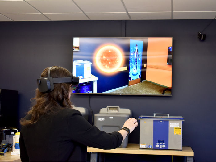 Anna Raffeinner, administrative support assistant and marketing for the NCPA LaunchBox, uses augmented reality equipment inside the Idea Lab on the campus of Penn State DuBois