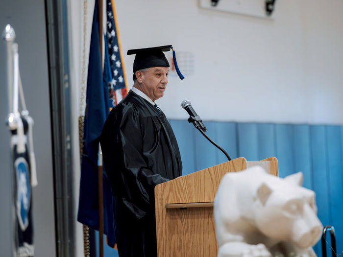 Penn State alumnus Michael Peduzzi, president and chief executive officer of CNB Financial Corporation and CNB Bank, address the graduating class during his address at the commencement ceremony at Penn State DuBois.