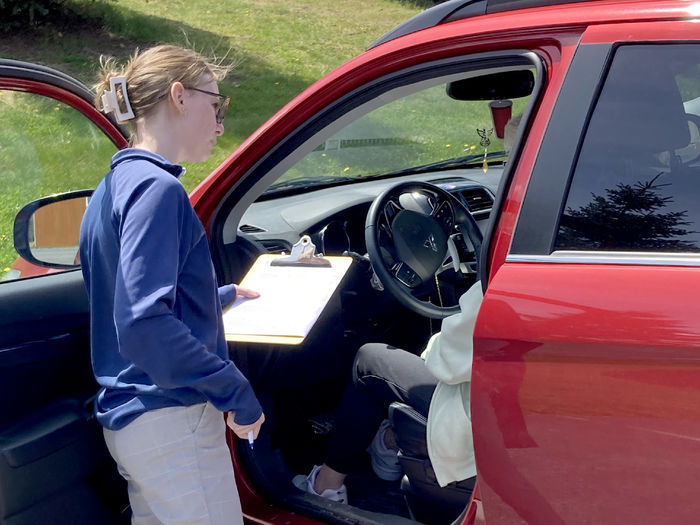 Penn State DuBois OTA student Fiona Riss assists an attendee with a CarFit session at the health and wellness fair at Christ the King Manor on April 25.