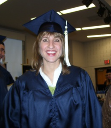 April M. Meyer in her cap and gown after graduation.