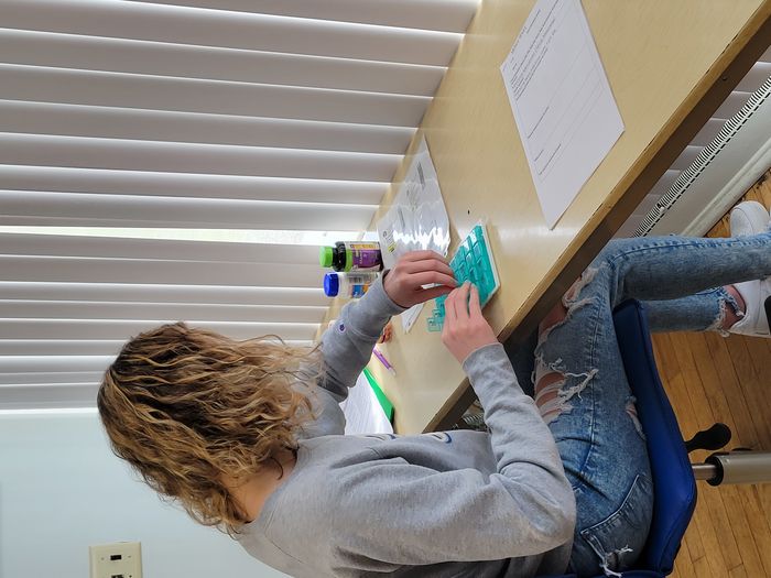 A student in OT 103 completes an activity analysis of medication management.