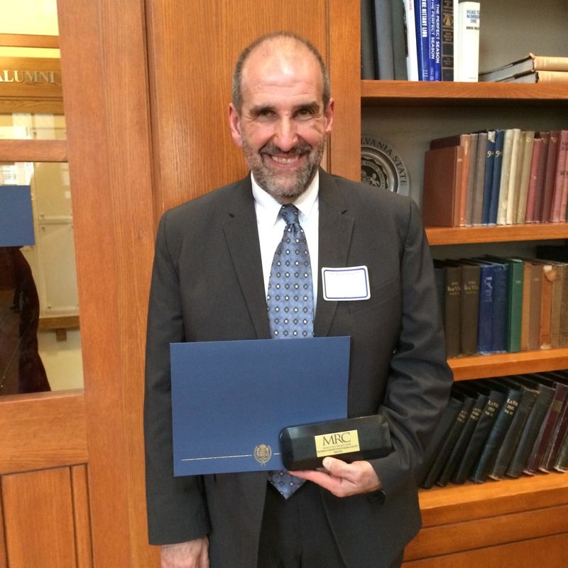 Robert Loeb with his 2015 John Romano Faculty/Staff Diversity Recognition Award. 