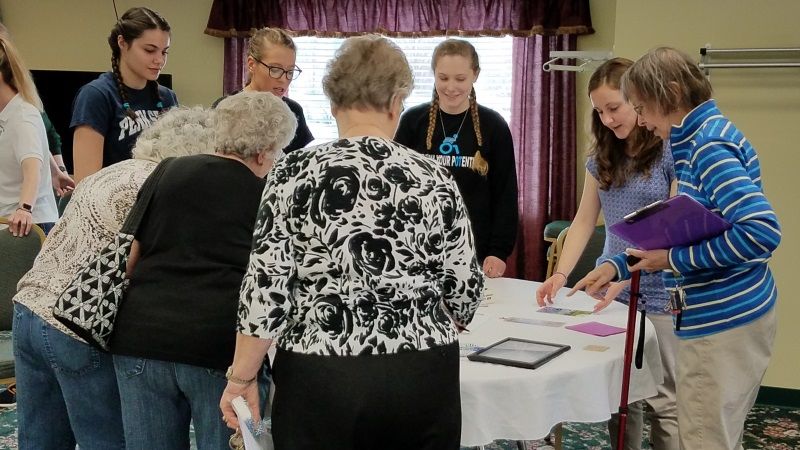 Each spring in OT 206 students complete a service learning experience while presenting at a community health fair for seniors.  They educate attendees on home safety, living with arthritis, low vision adaptations, and Carfit/older driver safety.