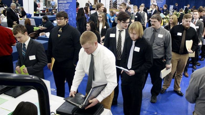 Students, alumni and community members get registered for the career fair at a previous year’s event