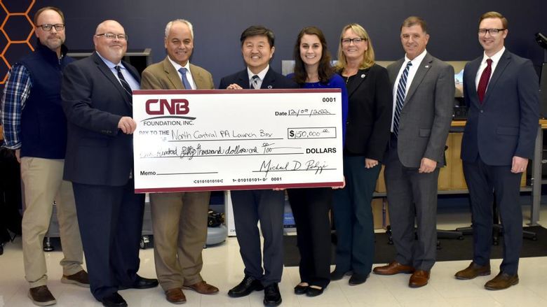 Leadership from CNB Bank present a check in support of the North Central PA LaunchBox