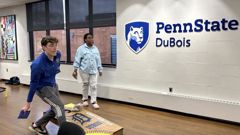 Penn State DuBois students Joey Morrison and Ay Adedeji playing cornhole during the recent game night event in the student union