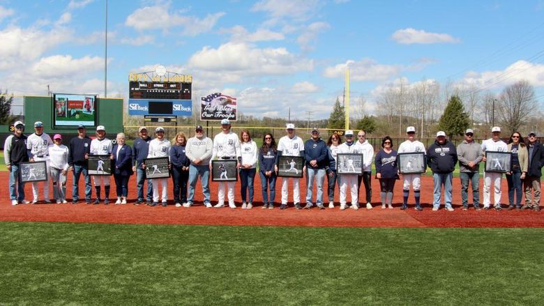 The senior members of the baseball team at Penn State DuBois, along with their family members, during their senior day recognition at Showers Field in DuBois.