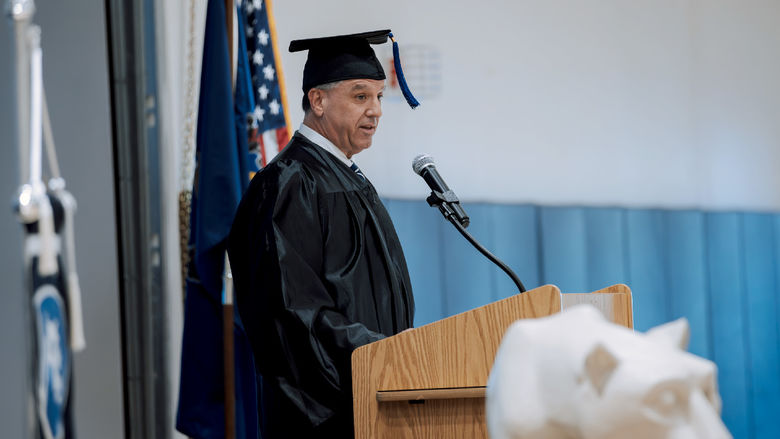 Penn State alumnus Michael Peduzzi, president and chief executive officer of CNB Financial Corporation and CNB Bank, address the graduating class during his address at the commencement ceremony at Penn State DuBois.