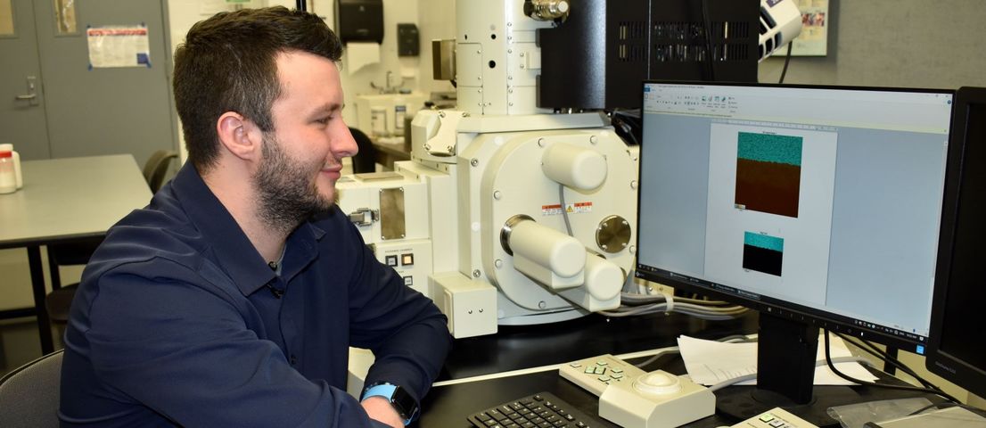 Student conducting research on a scanning electron microscope