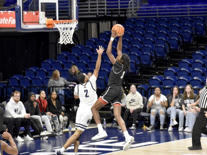 Penn State DuBois junior guard Niare Poplar goes up to slam the ball for a score during the PSUAC championship game at the Bryce Jordan Center.