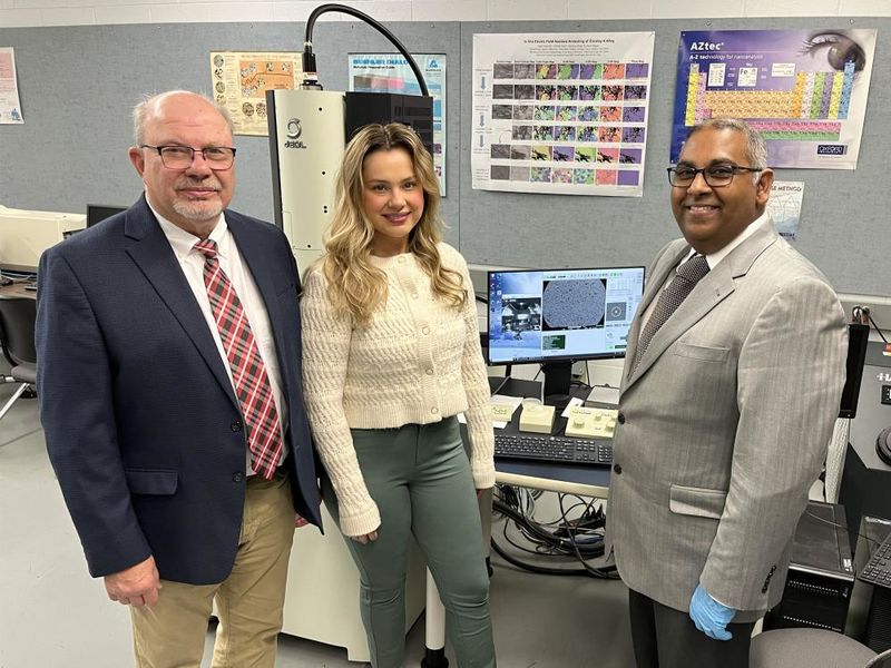 Ramakrishnan Rajagopalan, professor of engineering at Penn State DuBois, right, stands next to Tony Zaffuto, president of Metaltech, left, and Bethany Zaffuto, marketing lead for Metaltech, center, in one of the engineering labs at Penn State DuBois.