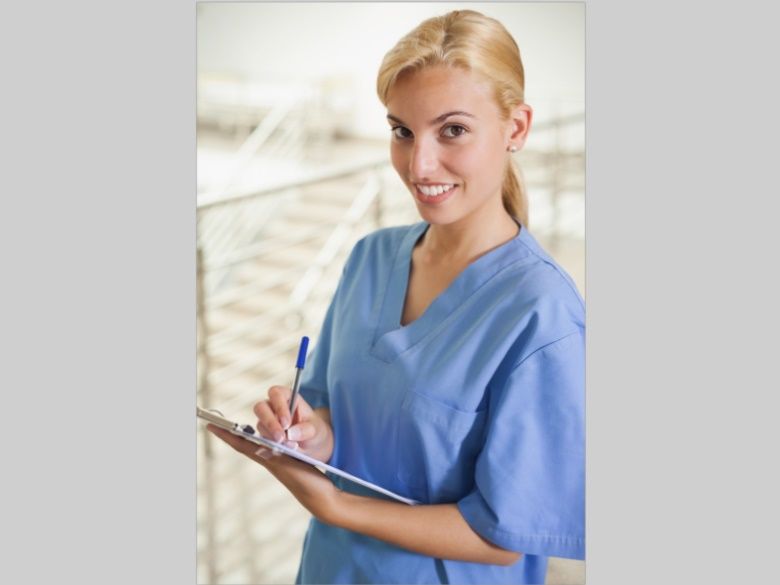 healthcare professional with a clip board in hand