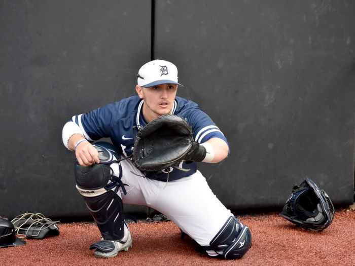 Lukas Salvo warming up a pitcher prior to a game for Penn State DuBois at Showers Field during a previous season