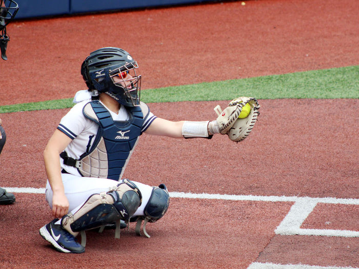 Larissa James-LaBranche catches and frames a pitch during a softball home game at Heindl Field in DuBois