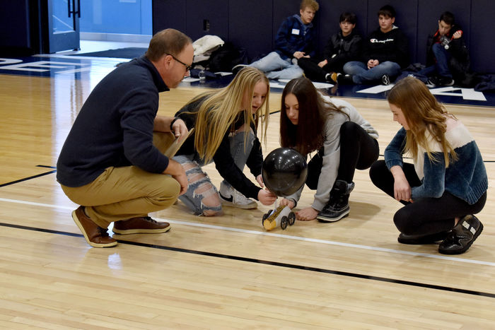 Students prepare to start their vehicle in the distance race at the PAW Center during STEAM Day at Penn State DuBois, under the guidance of Brad Lashinsky, program director for the North Central PA LaunchBox powered by Penn State DuBois.