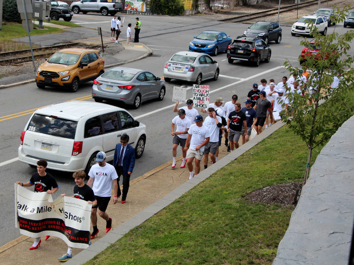 Walkers making the return route towards campus as they close in on the end of their mile journey during “Walk a Mile in Her Shoes”.