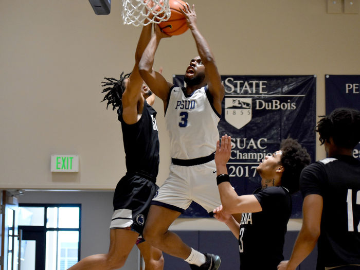 Penn State DuBois senior guard Jaiquil Johnson gets up a contested shot in the paint during a basketball game this season at the PAW Center. Johnson was selected as member of the first team all-conference this year.