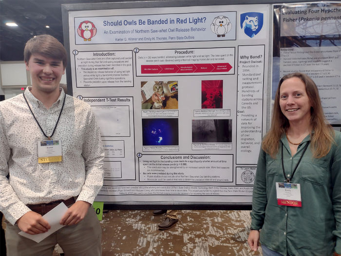 Emily Thomas, right, stands with one of her students, now alumnus, Karter Witmer, during a presentation at the Northeast Fish and Wildlife Conference. Thomas served as the research adviser for Witmer’s study.