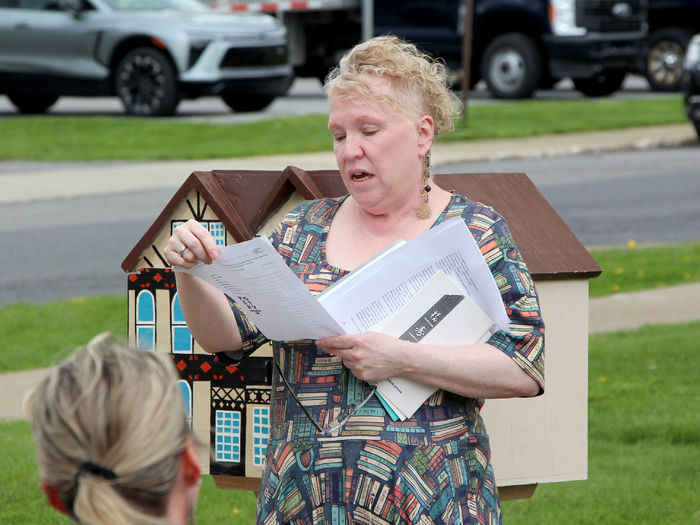 Jackie Atkins, assistant teaching professor of English, reads one of her husband Tony Vallone’s original poems during the Little Free Library dedication at Penn State DuBois on April 29.