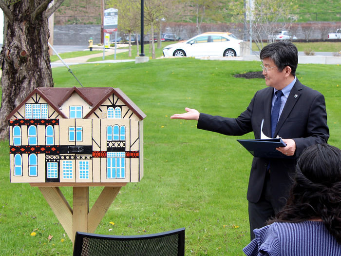 Jungwoo Ryoo, chancellor and chief academic officer at Penn State DuBois, draws attention to the newly installed Little Free Library during its dedication ceremony held on April 29.