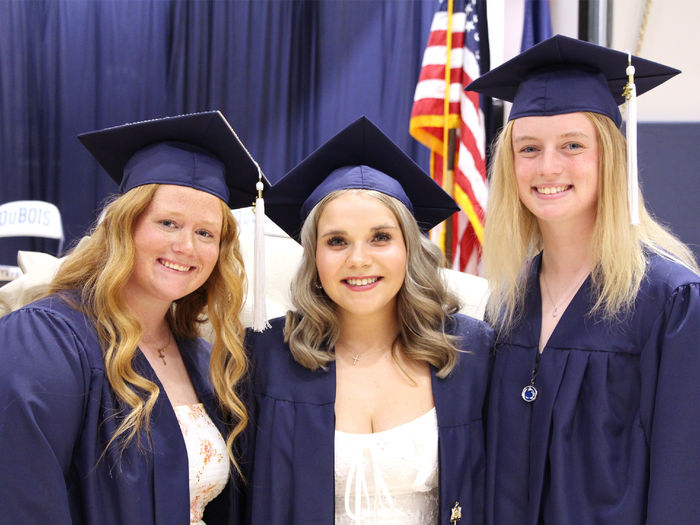 New Penn State graduates Chelsea Busatto, left, Makena Baney, center, and Kamryn Mactavish, right, smile for a photo after the spring commencement ceremony at Penn State DuBois. Busatto, Baney and Mactavish are teammates on the Penn State DuBois softball team.
