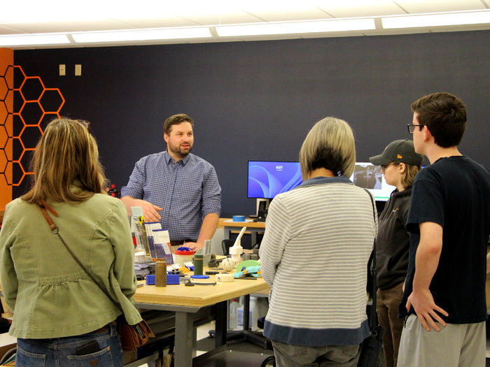 Johnny Williams, engineering technologist at Penn State DuBois and the NCPA LaunchBox, gives a group of attendees at the Industry 4.0 Academy open house a tour of the Idea Lab, one of the many sites used in the academy at Penn State DuBois.