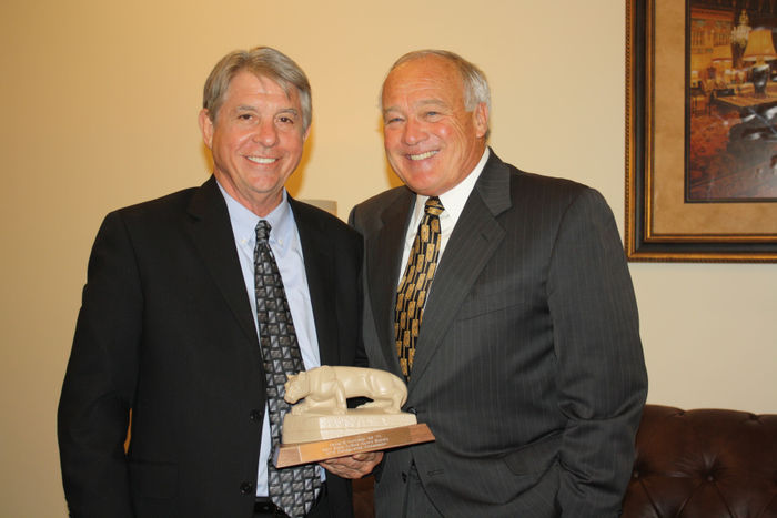 Dan Kohlhepp '69 receiving the Distinguished Ambassador Award from Ryan McCombie '70