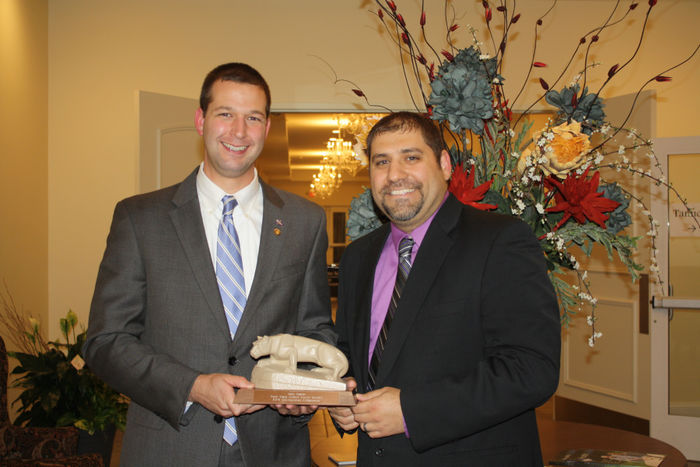 Matt Gabler receiving the Distinguished Ambassador Award from Nick Suplizio '02