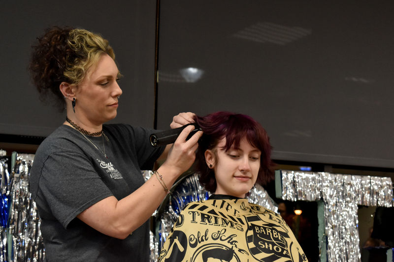 Marilla Mancuso has her hair buzzed during the THON hair auction at Penn State DuBois