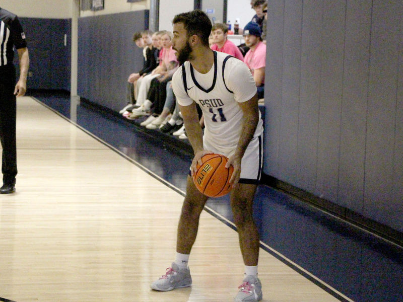 Penn State DuBois freshman guard Kaleb Pryor holds the ball and positions himself to make a pass to a cutting teammate in the lane during a recent game at the PAW Center, on the campus of Penn State DuBois.