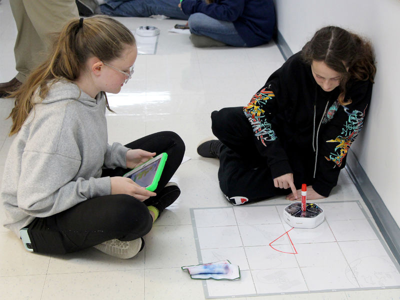 Students attending Discover Engineering Day at Penn State DuBois learn about programing by using a robot to draw different designs, such as shapes and letters.