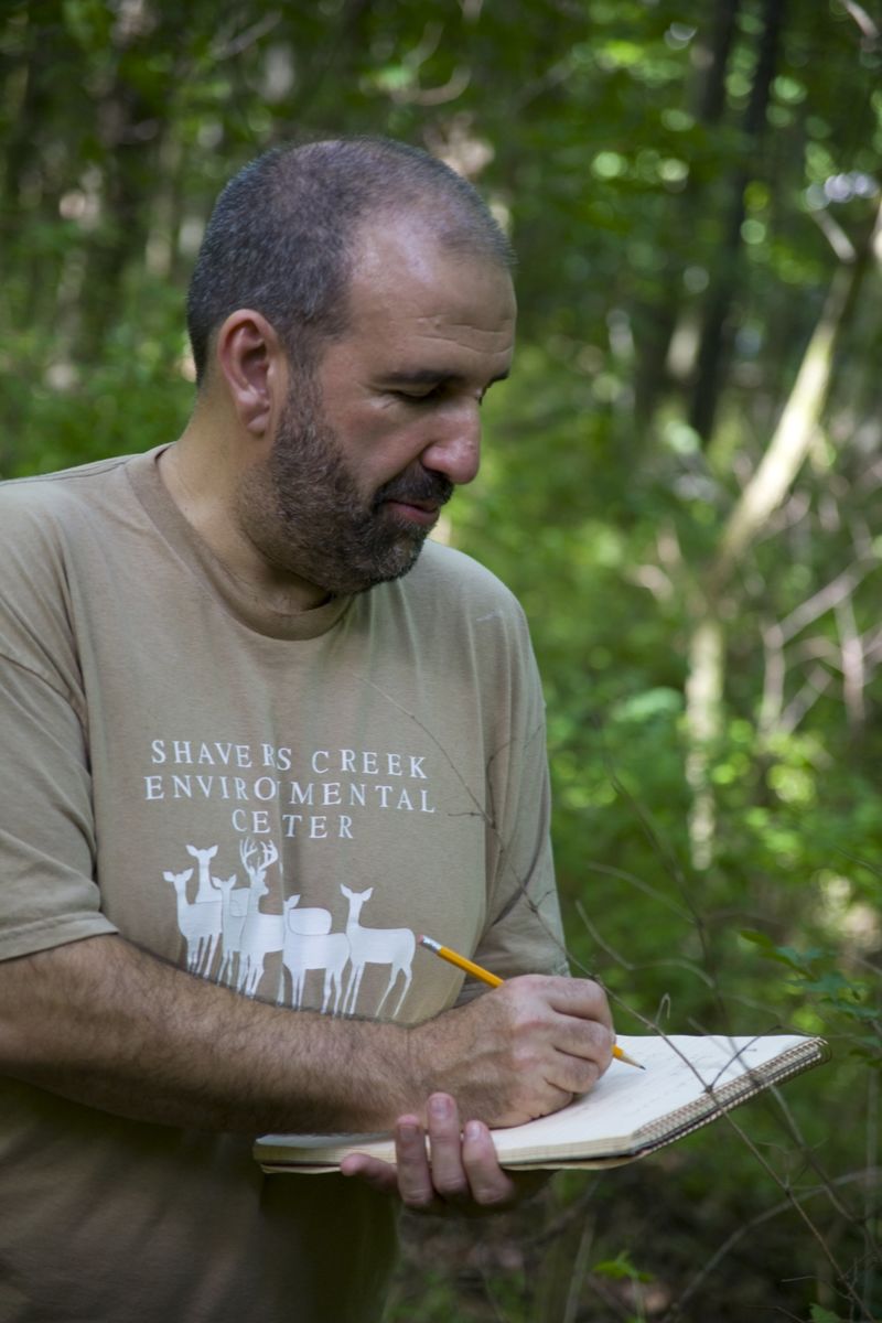 Associate Professor of Biology and Forestry Robert Loeb conducting fieldwork. 