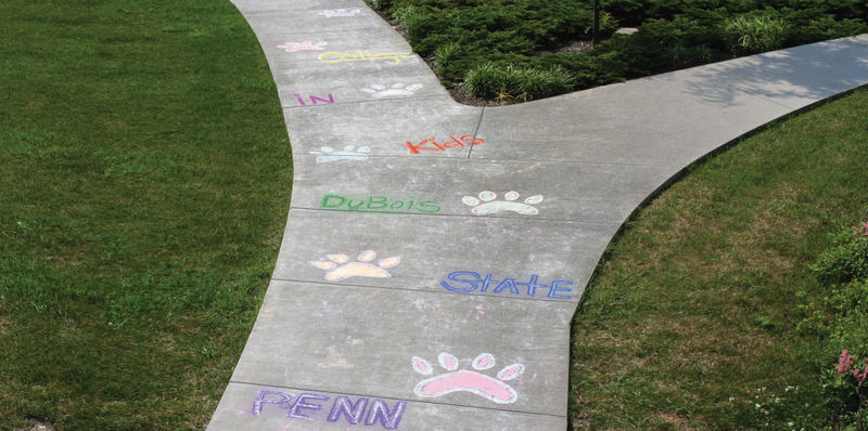 Penn State DuBois sidewalk with chalk drawings from Kids in College