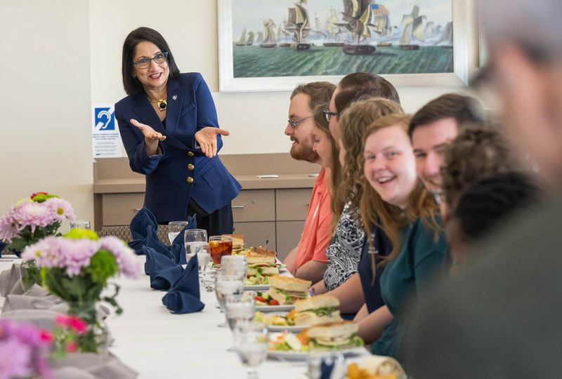 Penn State President-elect Neeli Bendapudi gestures while talking with student leaders at Penn State Behrend.