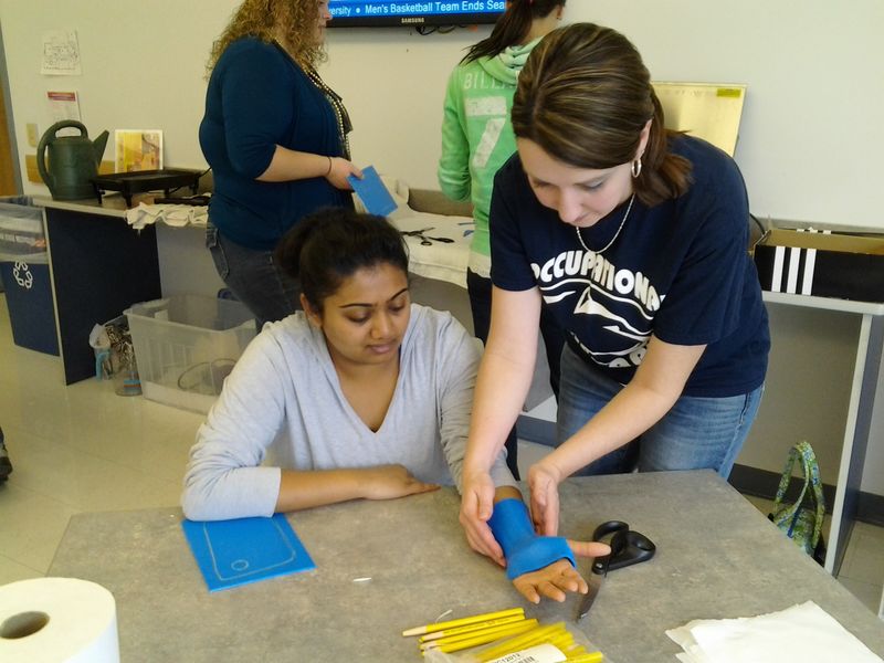 In OT 206, students participate in a hands-on splinting skills workshop.
