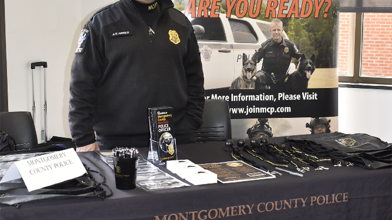 Officer represents an employer at career event