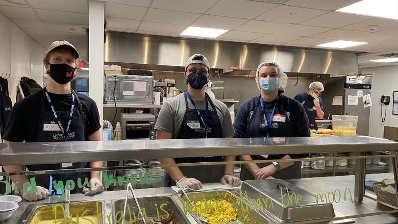 Students serve meals at a Pittsburgh area mission