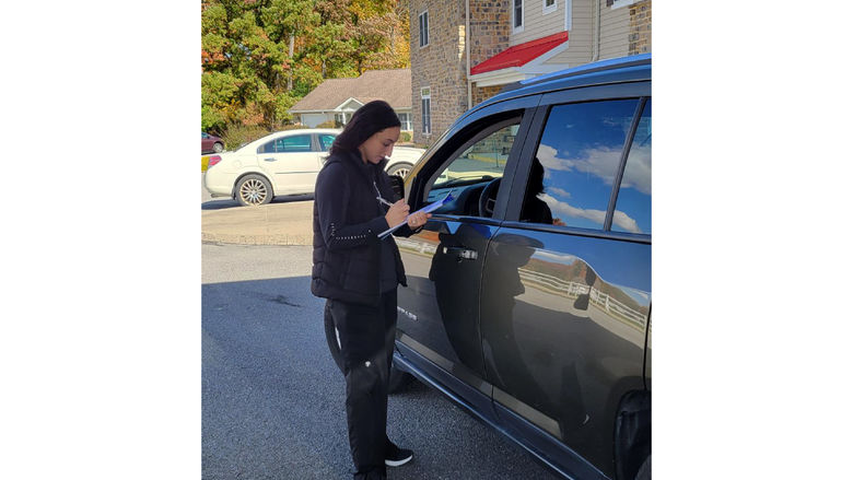 Penn State DuBois alumnus Haley Gray gathers information during an evaluation at the CarFit event at Windy Hill Village.