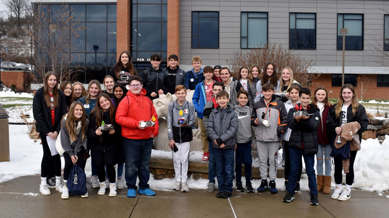 Students gather around the Nittany Lion shire prior to racing their vehicles in the PAW Center