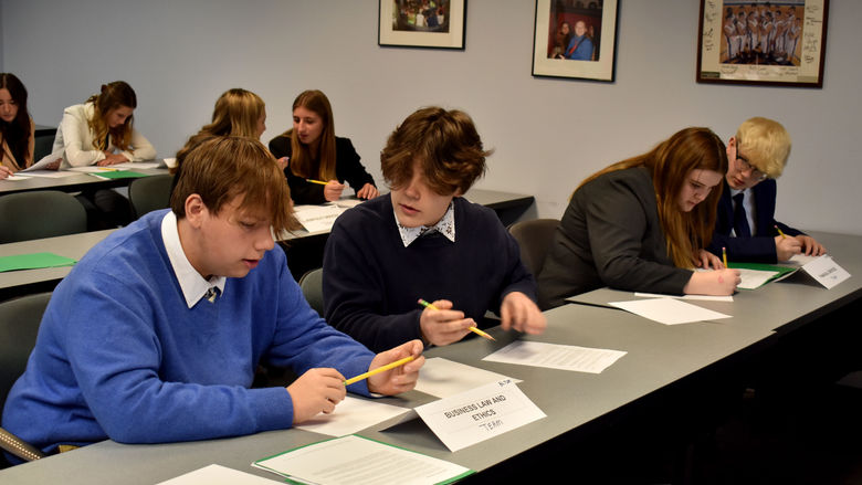 Students work through their role play scenarios prior to giving their presentation to a judge.