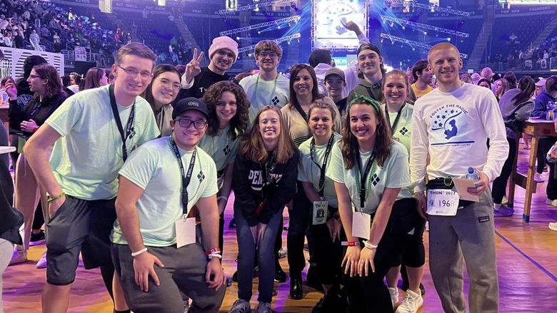 Members of the Penn State DuBois campus community, including the dancers representing the campus, gather on the main floor of the Bryce Jordan Center during the THON dance marathon