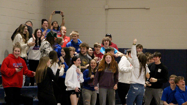 Fans and students from Saint Marys celebrate their team’s win in the championship match of the interscholastic unified sports bocce regional championship
