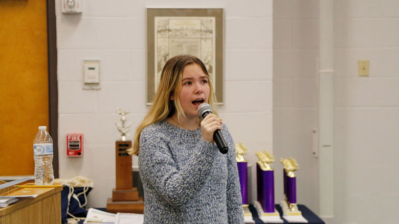 Clearfield Area High School student and competitor Sage Hoppe performs the national anthem at the senior scholastic challenge, hosted at Penn State DuBois
