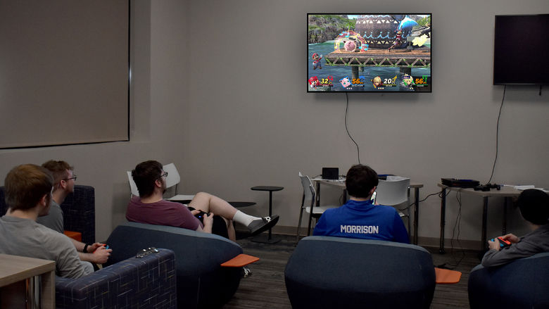 Students and members of the esports club at Penn State DuBois playing Super Smash Bros. during the inaugural game night in the gaming lounge at the PAW Center
