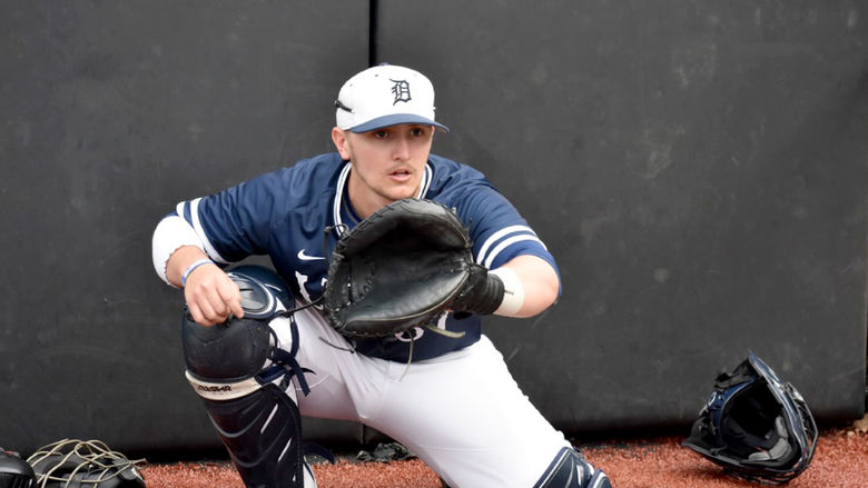 Lukas Salvo warming up a pitcher prior to a game for Penn State DuBois at Showers Field during a previous season