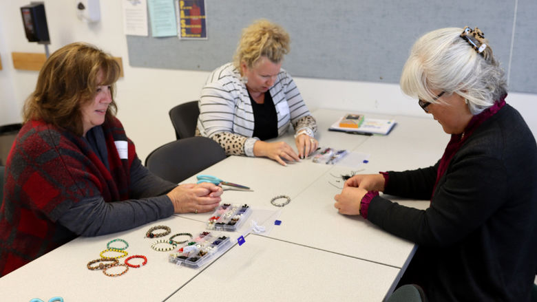 Hyeseon Kim, community outreach coordinator for the institute for Korean studies, right, leads Diana Kreydt, student advocacy specialist, and Selena Price, lecturer in criminal justice, through an exercise during the DEIB workshop held at Penn State DuBois in October.